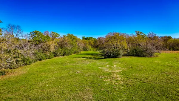 a view of a yard with an outdoor space