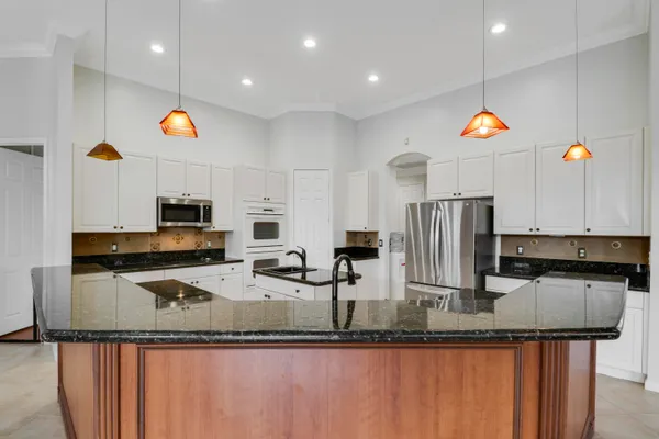 a kitchen with counter top space cabinets and stainless steel appliances