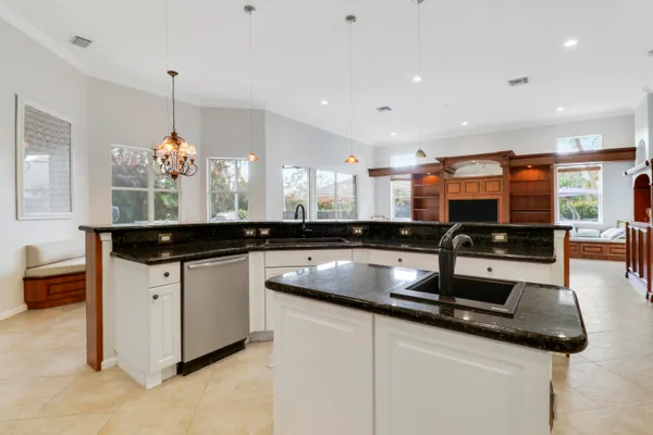 a kitchen with stainless steel appliances a stove microwave and refrigerator