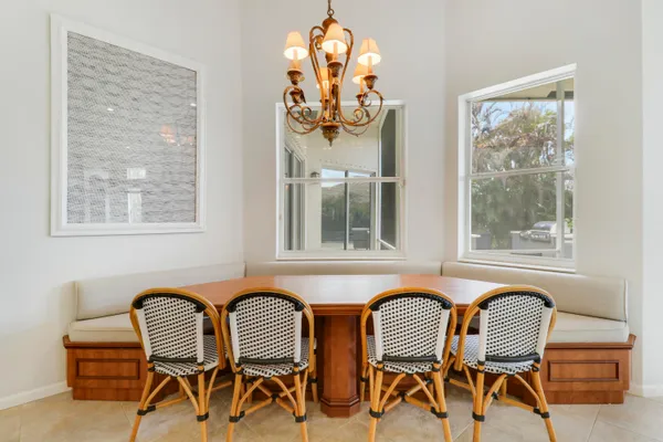 a view of a room with furniture and chandelier