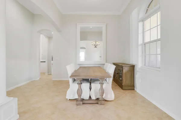 a view of a dining room with furniture and a window