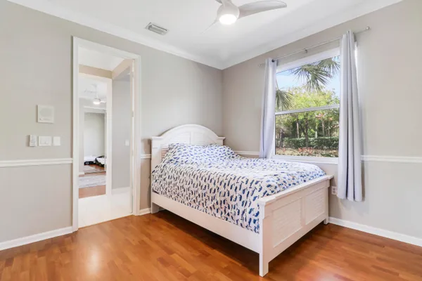 a bedroom with bed and window