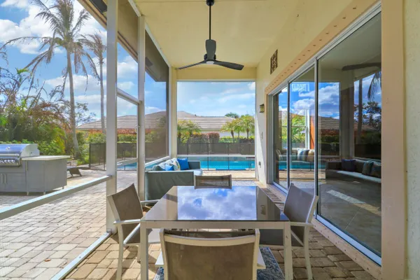 a view of a patio with table and chairs