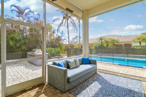 a view of swimming pool with lounge chair