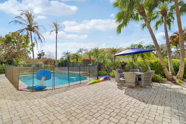 a aerial view of a house with swimming pool garden and patio