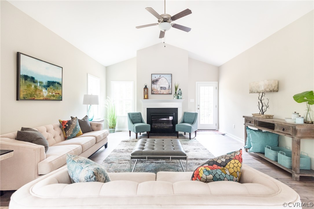 a living room with furniture and a fireplace