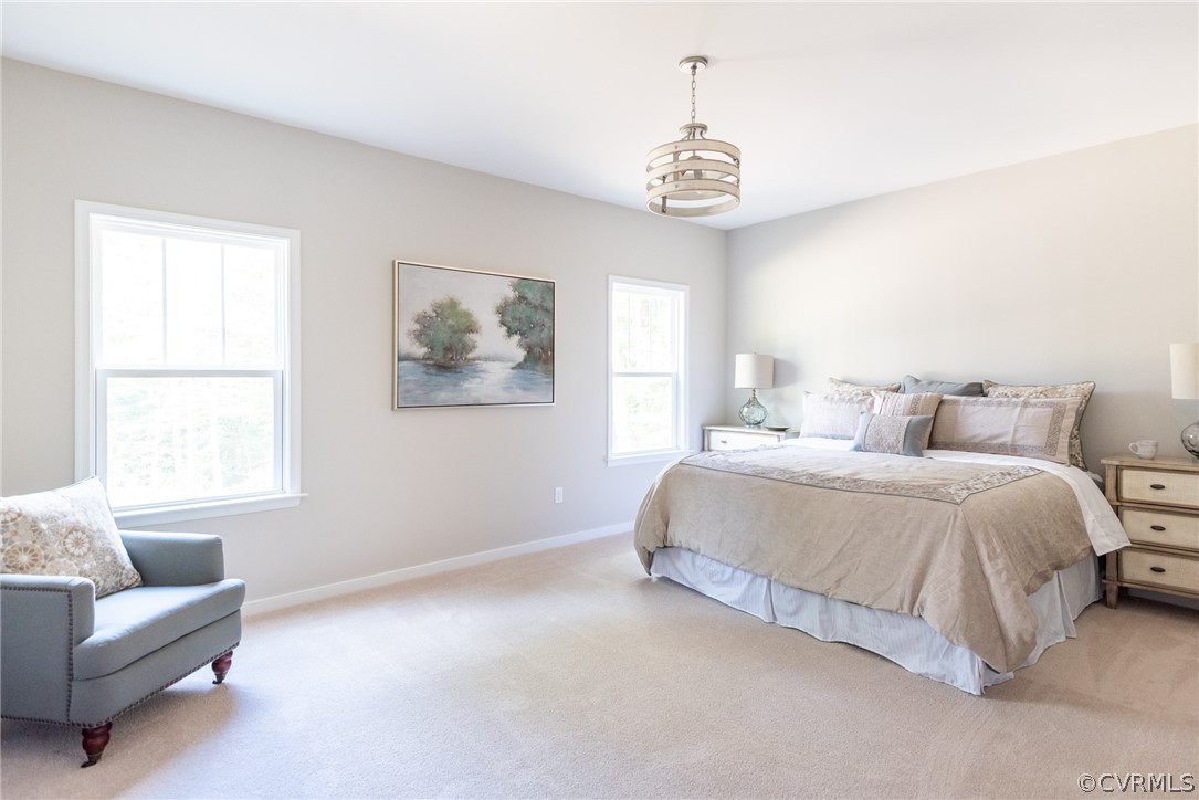 4936 Lancewood Road Chesterfield, VA 23832 - Photo 16 of 24 a spacious bedroom with a bed and a couch