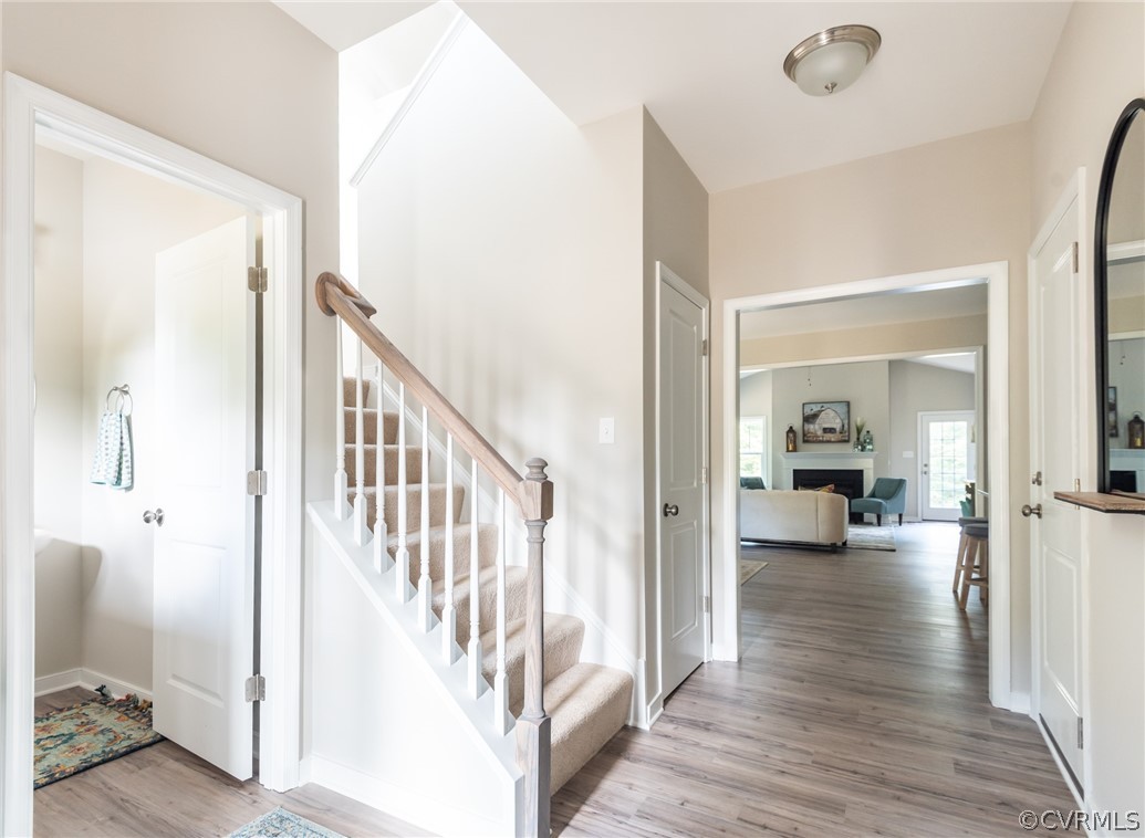 4936 Lancewood Road Chesterfield, VA 23832 - Photo 2 of 24 a view of a hallway view with wooden floor and staircase