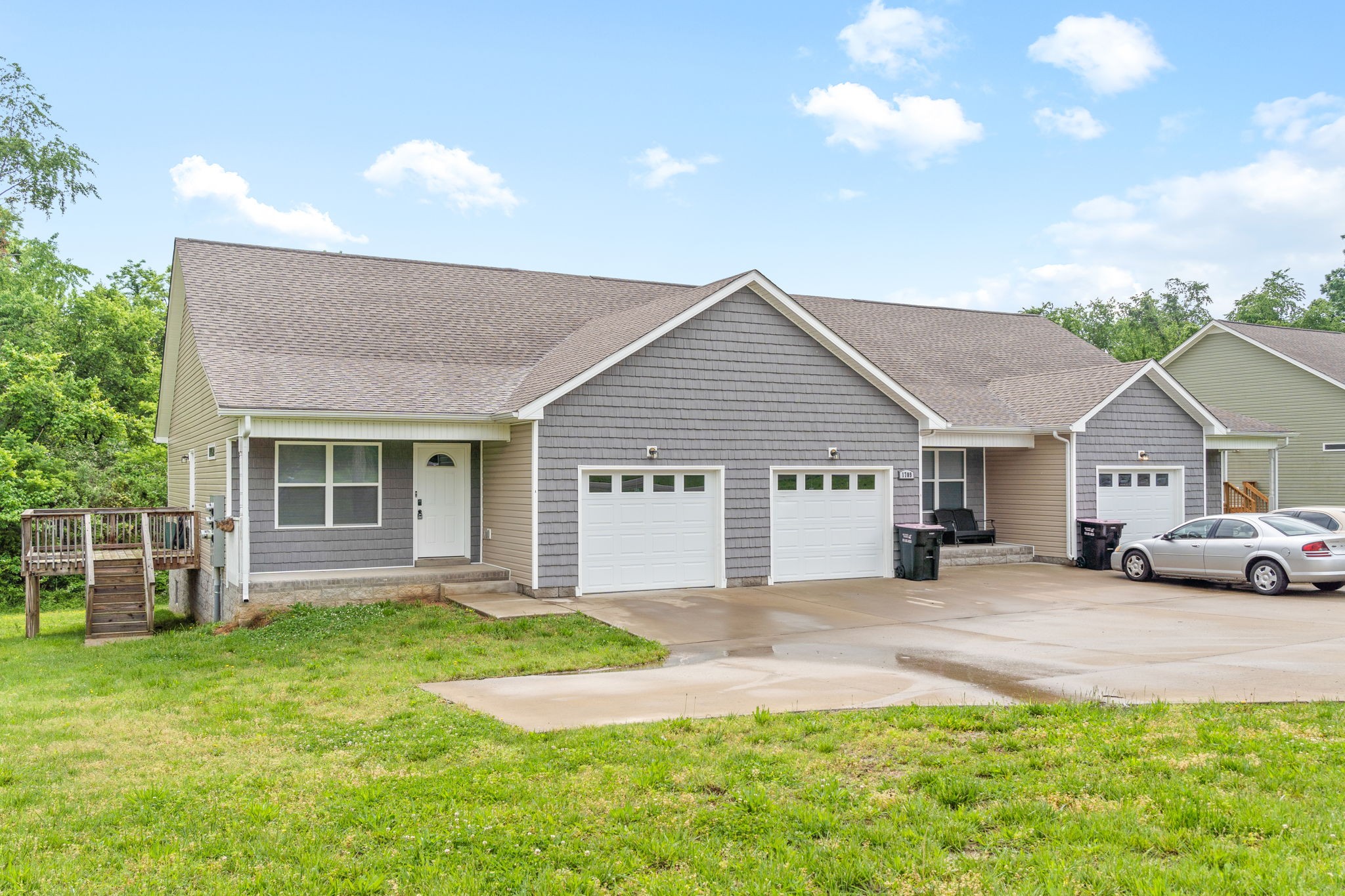 1709 Evans Road, Unit A Clarksville, TN 37042 - Photo 1 of 23 a front view of a house with a garden and yard