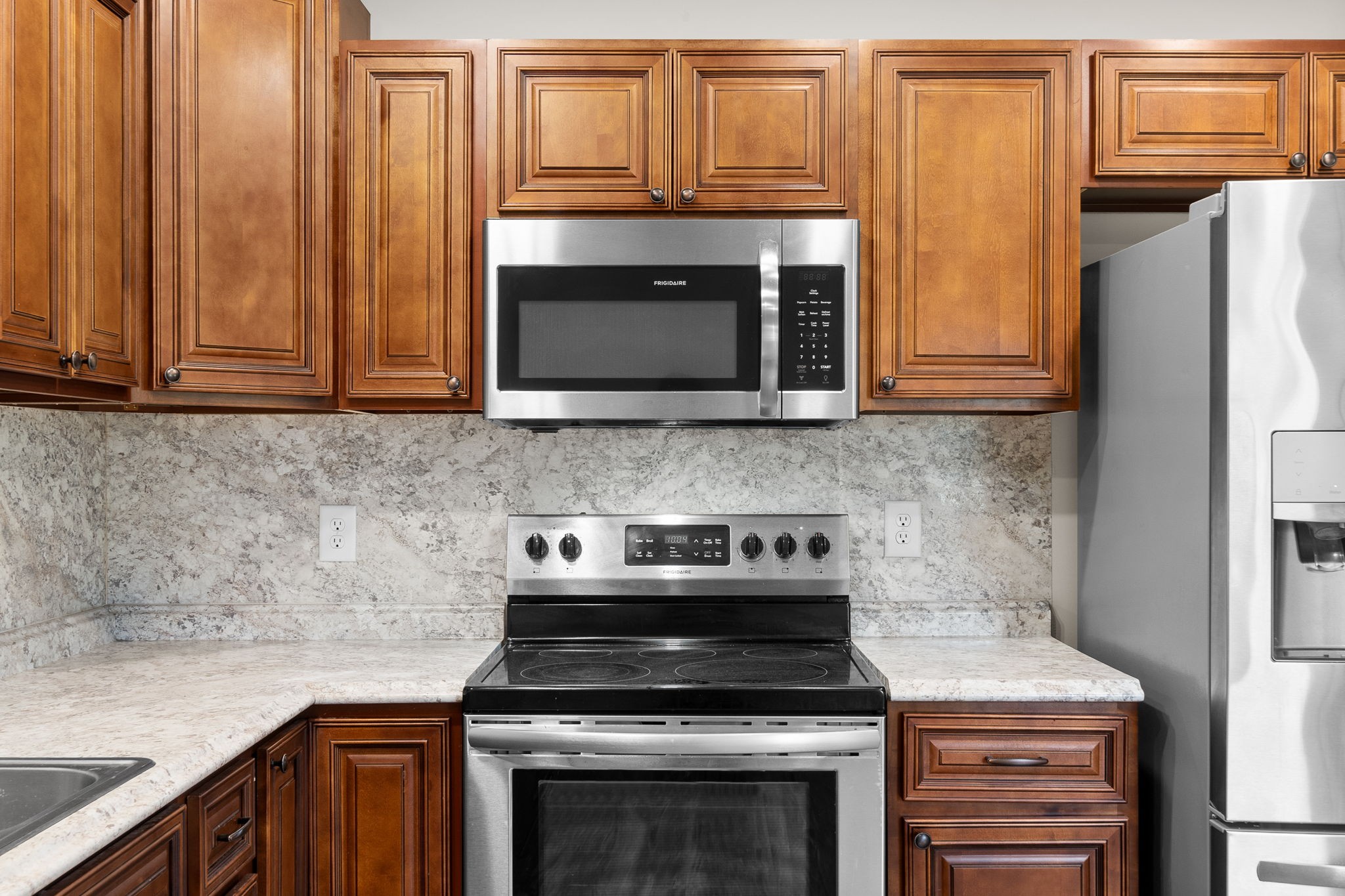 1709 Evans Road, Unit A Clarksville, TN 37042 - Photo 13 of 23 a kitchen with granite countertop a stove and a microwave