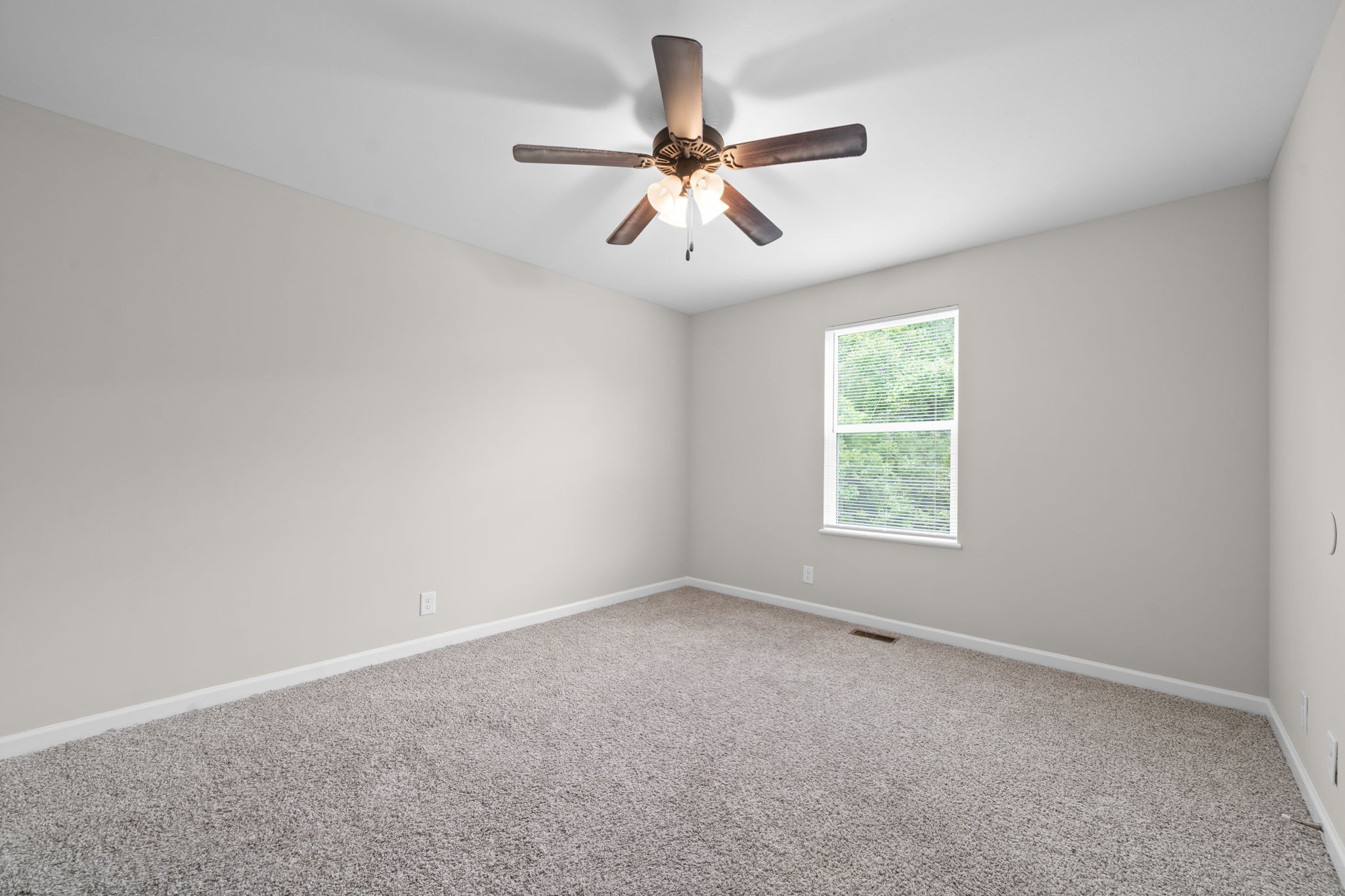 1709 Evans Road, Unit A Clarksville, TN 37042 - Photo 16 of 23 an empty room with a window and a fan