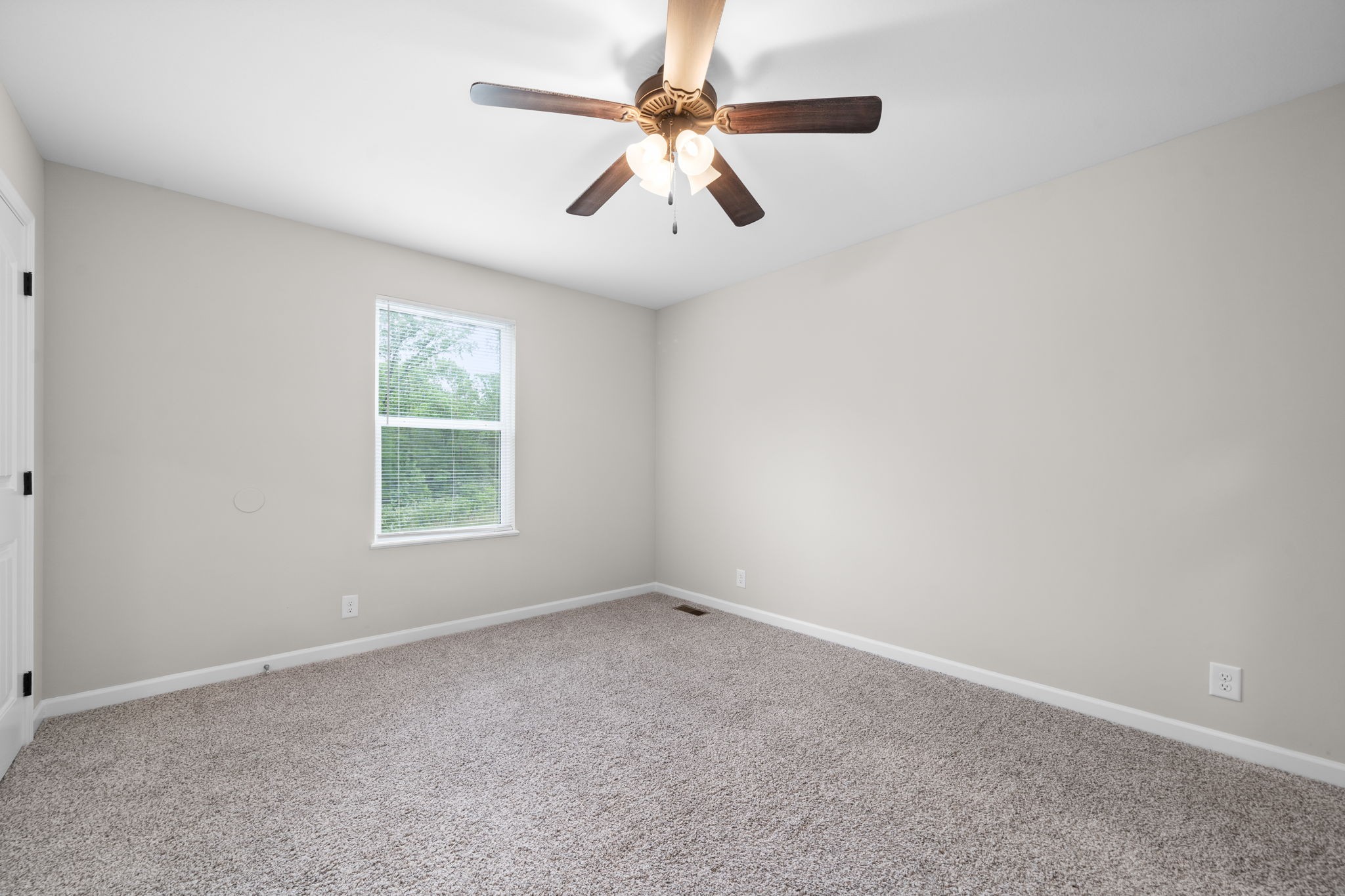 1709 Evans Road, Unit A Clarksville, TN 37042 - Photo 18 of 23 an empty room with windows and fan