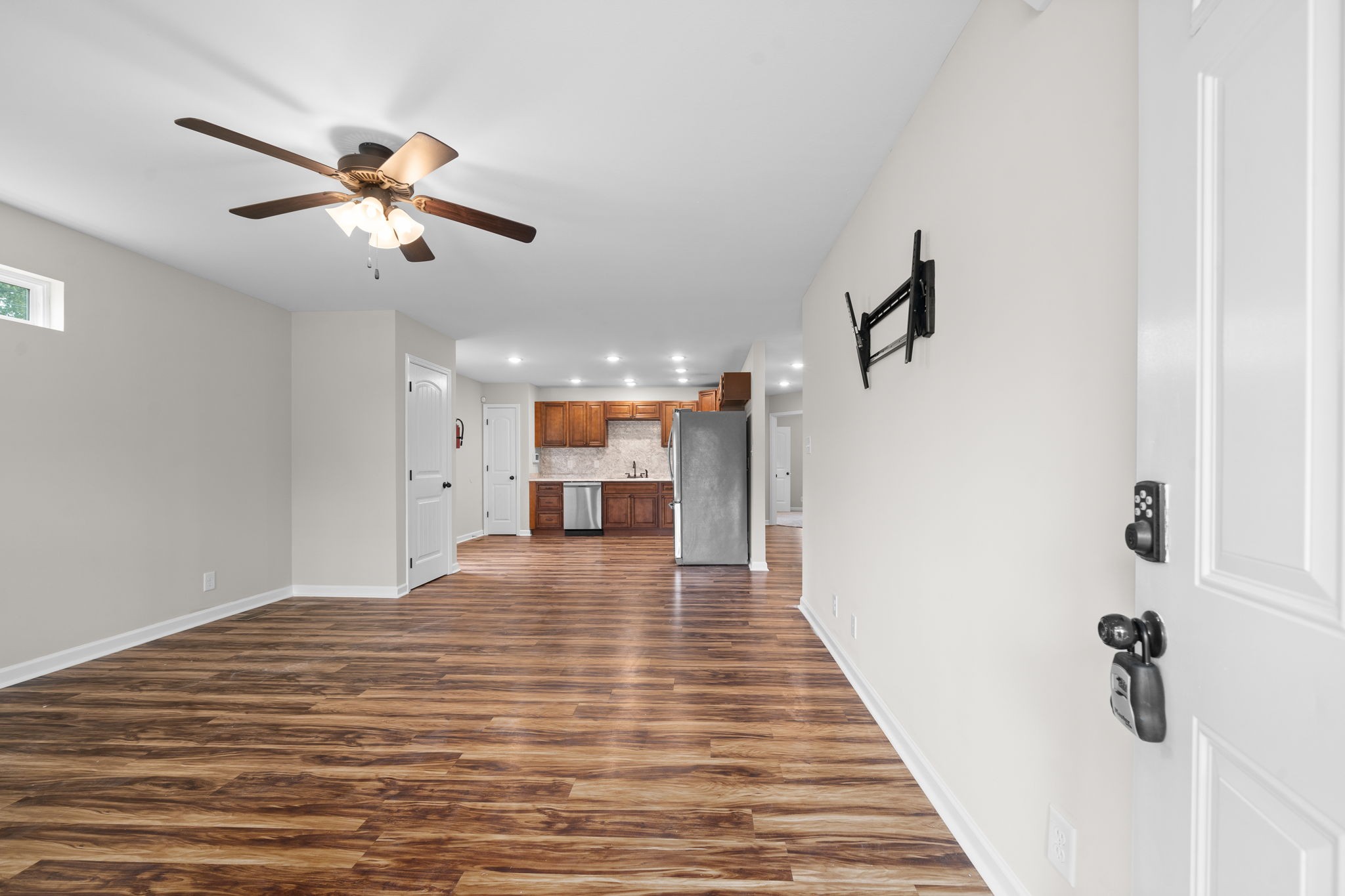 1709 Evans Road, Unit A Clarksville, TN 37042 - Photo 3 of 23 a view of a room with a ceiling fan and wooden floor