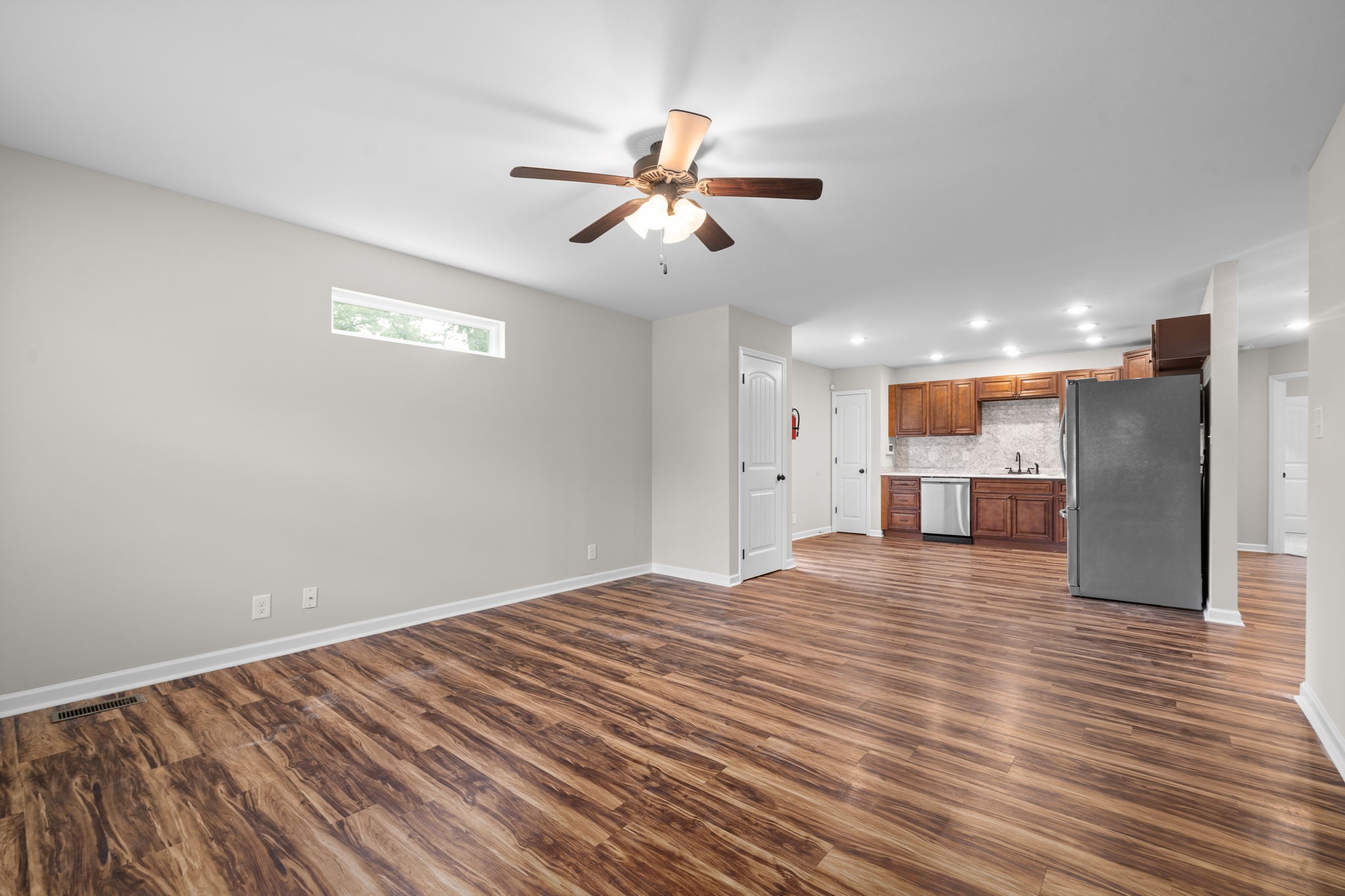 1709 Evans Road, Unit A Clarksville, TN 37042 - Photo 4 of 23 a view of empty room with wooden floor and ceiling fan