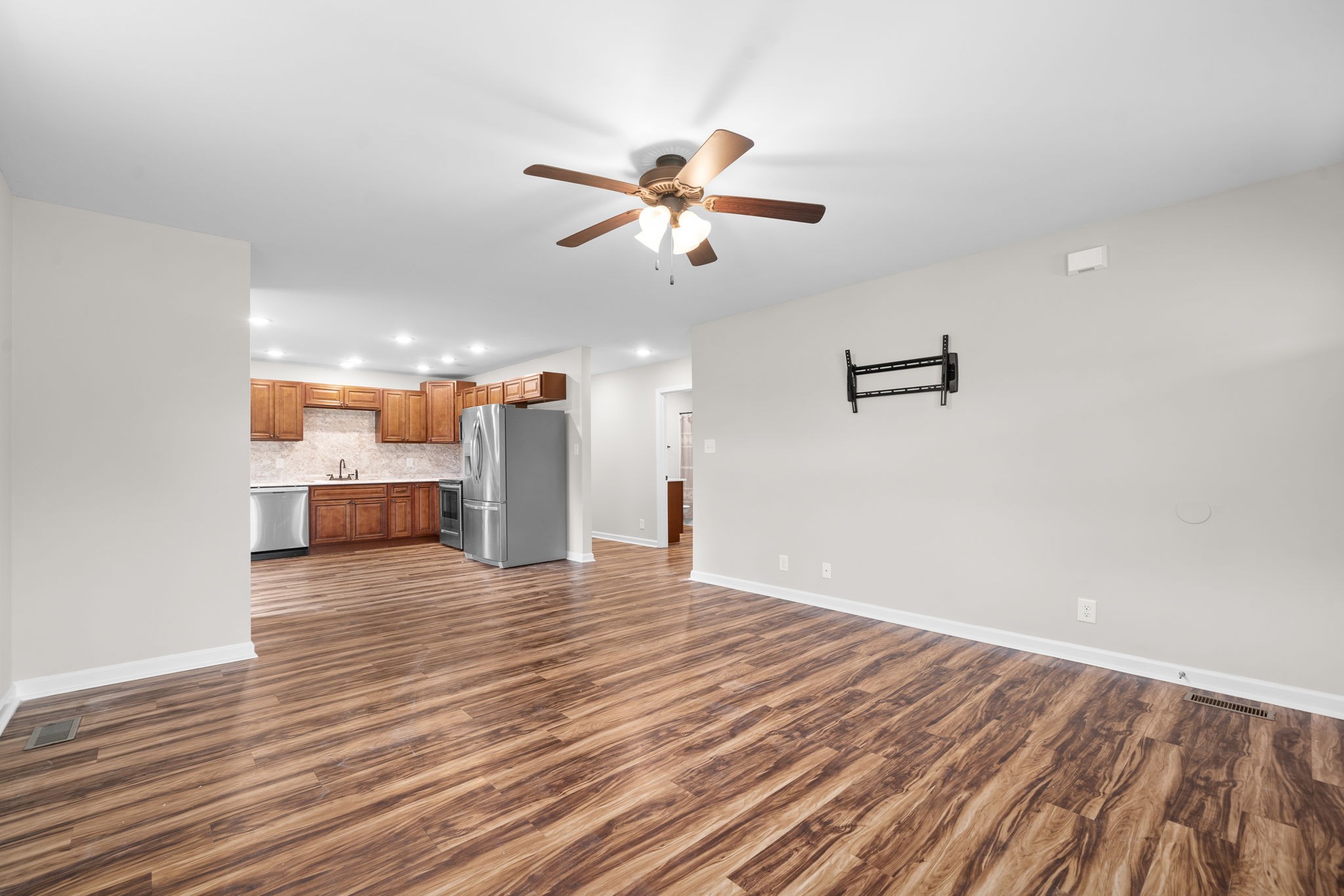 1709 Evans Road, Unit A Clarksville, TN 37042 - Photo 5 of 23 a view of a livingroom with a ceiling fan wooden floor and a ceiling fan