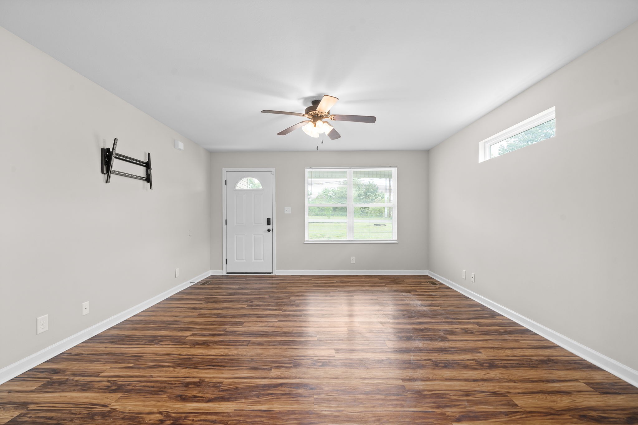 1709 Evans Road, Unit A Clarksville, TN 37042 - Photo 6 of 23 wooden floor in an empty room with a window