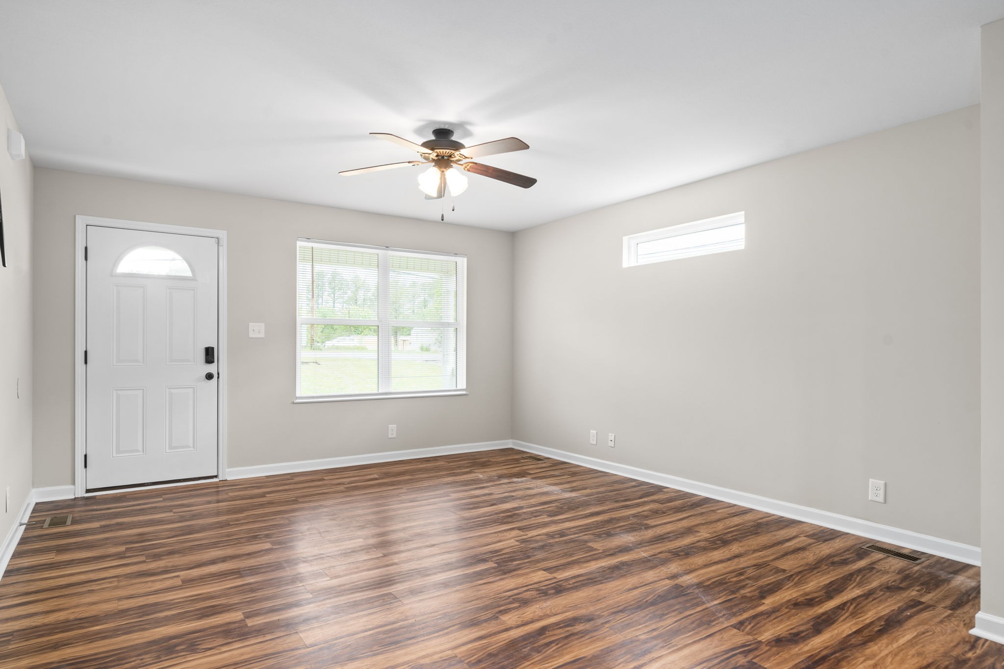 1709 Evans Road, Unit A Clarksville, TN 37042 - Photo 7 of 23 a view of empty room with wooden floor and fan