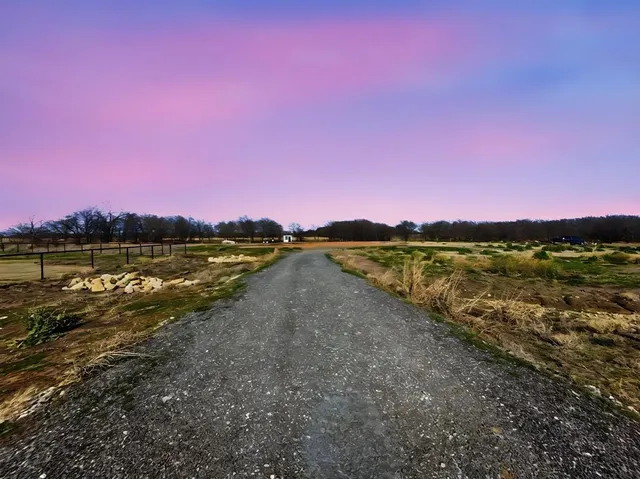 a view of a lake with houses in the background