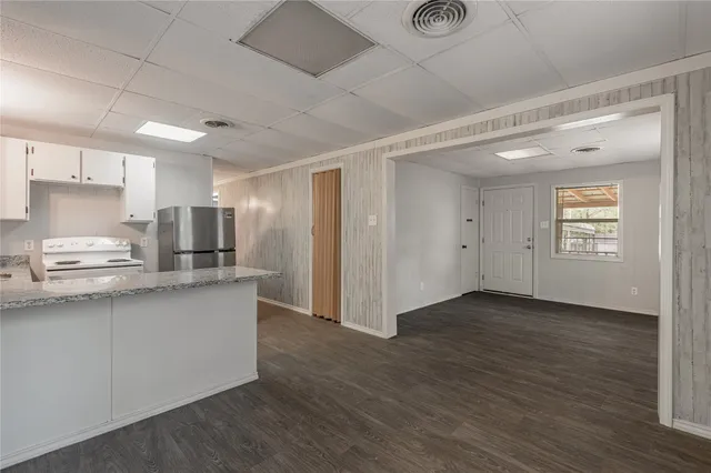 a kitchen with stainless steel appliances granite countertop a sink and cabinets