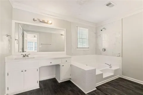 a bedroom with a bed and a ceiling fan
