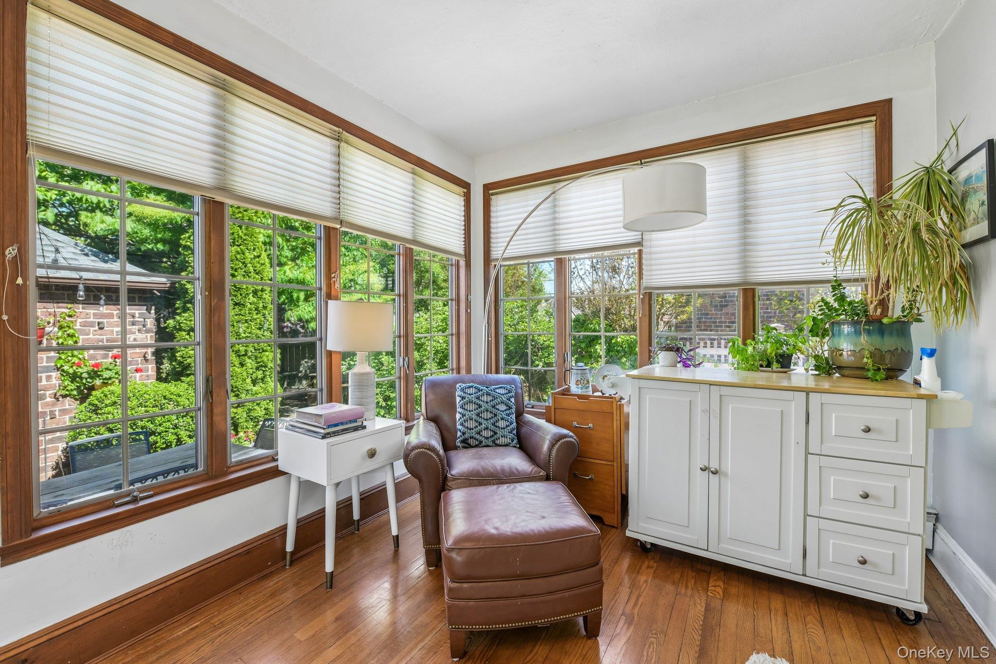 60 Croyden Road Mineola, NY 11501 - Photo 14 of 33 Hardwood flooring extends throughout this room, featuring ample natural light from multiple windows