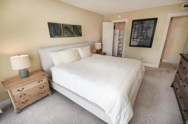 a bedroom with a bed and a couch