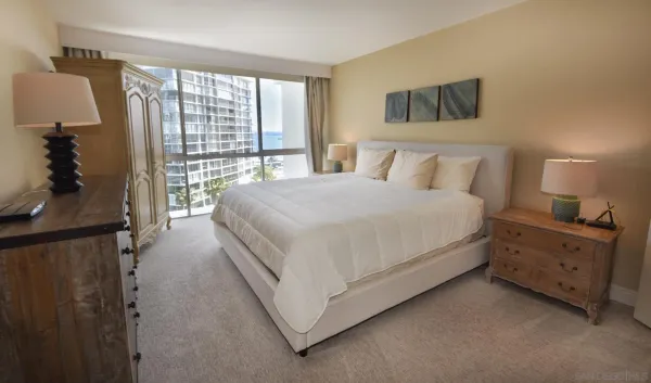 a bed room with a bed and a night stand