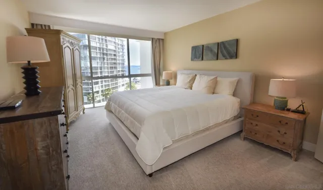 a bed room with a bed and a night stand