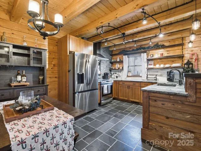 a kitchen with a sink appliances and cabinets