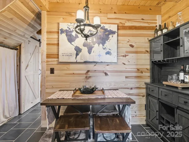 a kitchen with a table and chairs in it