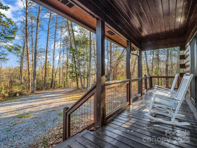 a view of a porch with wooden floor and outdoor space
