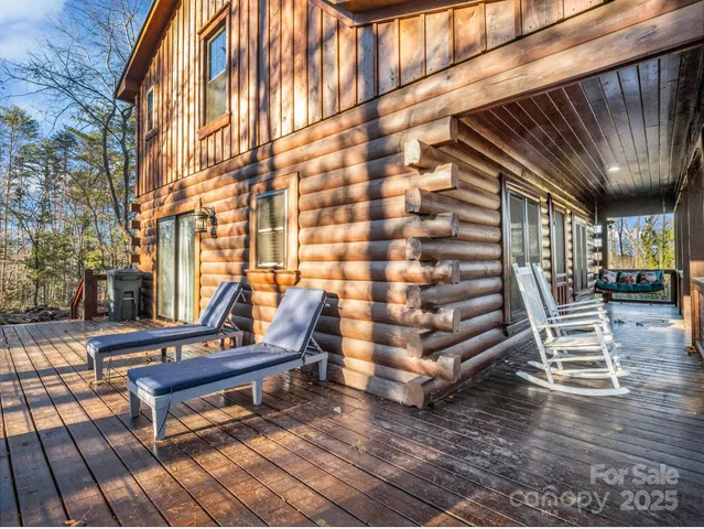 a wooden bench sitting in front of a building
