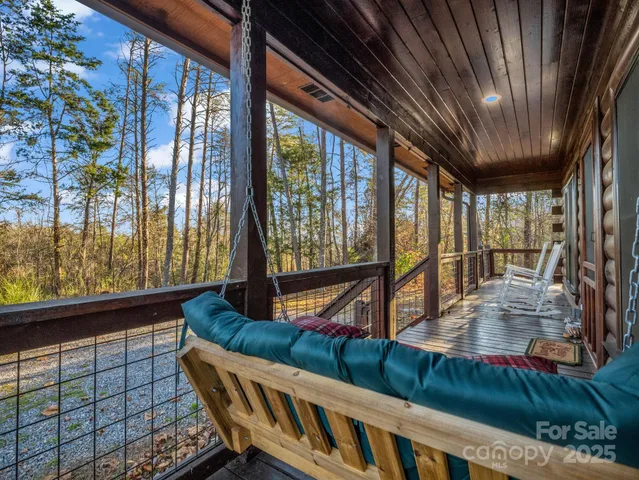 a view of an chairs and table in the balcony
