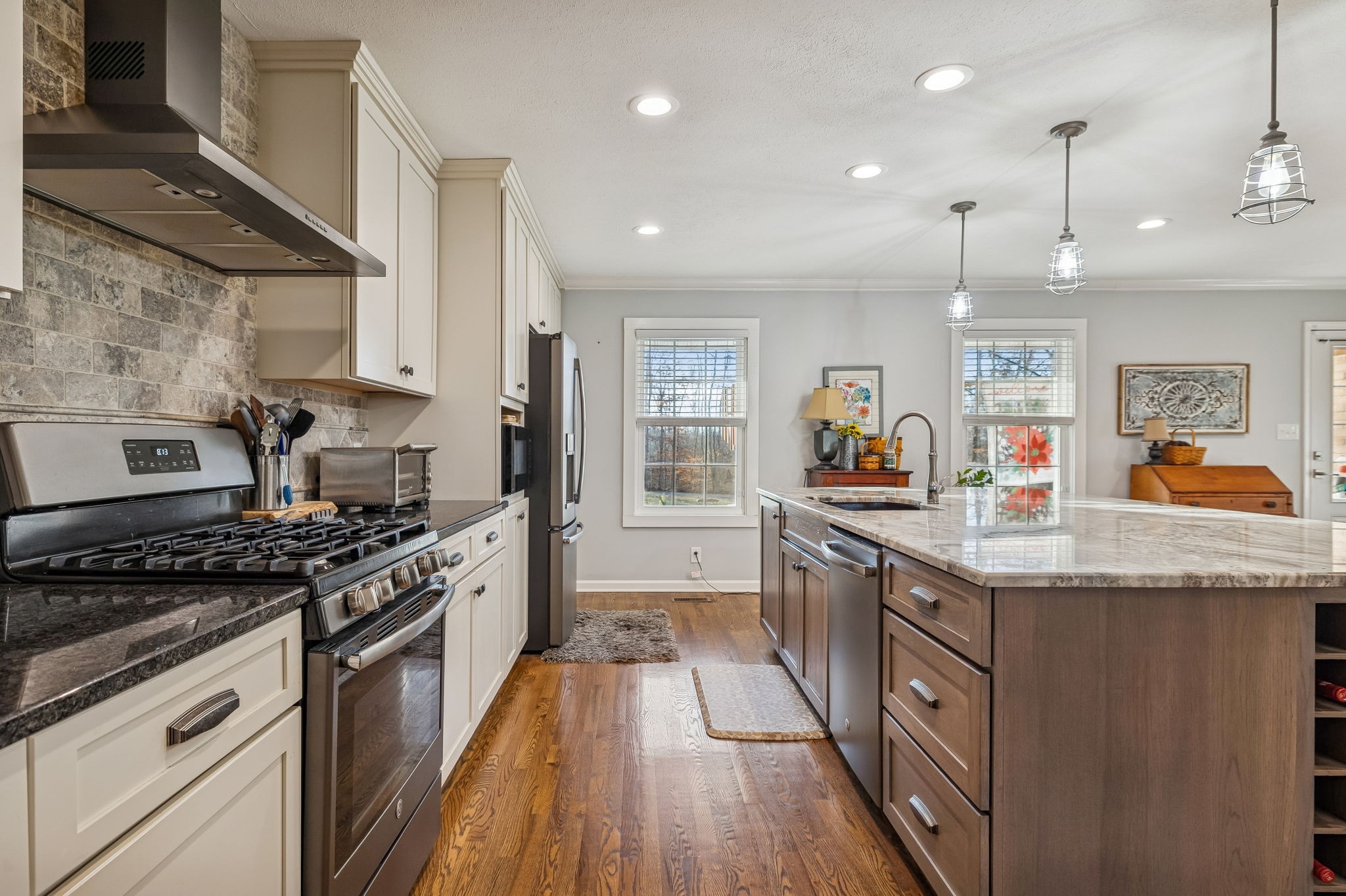 1060 Satterwhite Road Ashland City, TN 37015 - Photo 14 of 38 a kitchen with granite countertop counter space a sink stainless steel appliances and cabinets