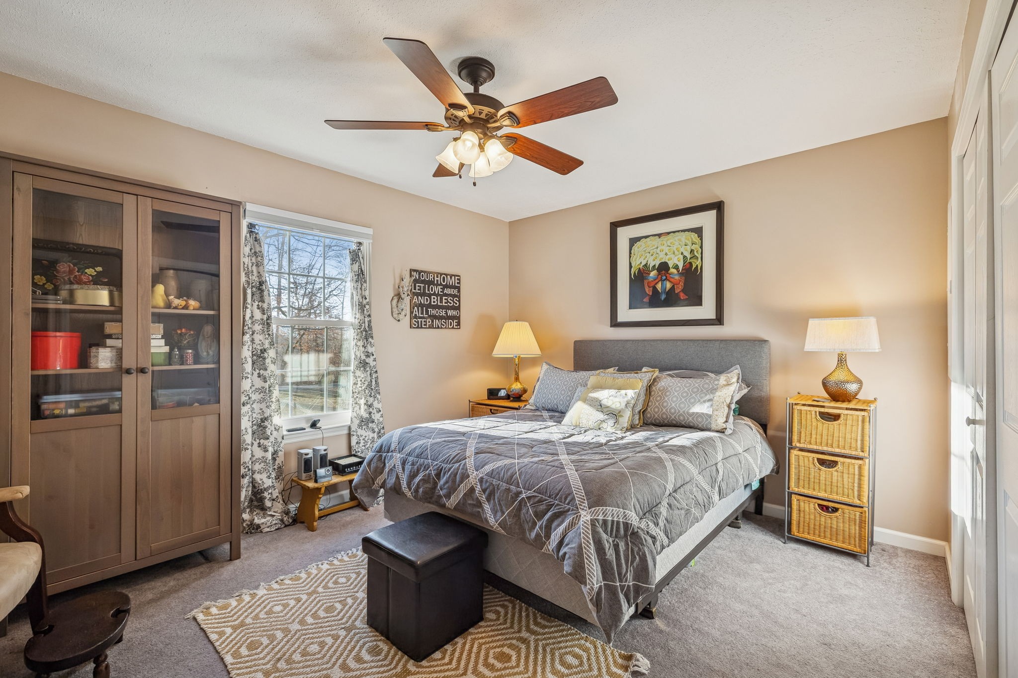 1060 Satterwhite Road Ashland City, TN 37015 - Photo 24 of 38 a bedroom with a bed and a chandelier