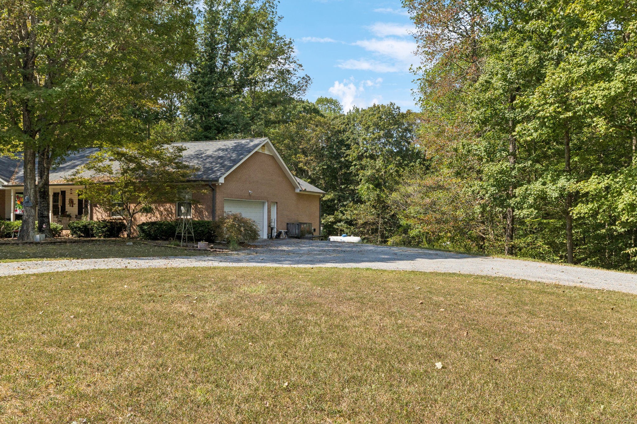1060 Satterwhite Road Ashland City, TN 37015 - Photo 30 of 38 a view of a house with a yard and garage
