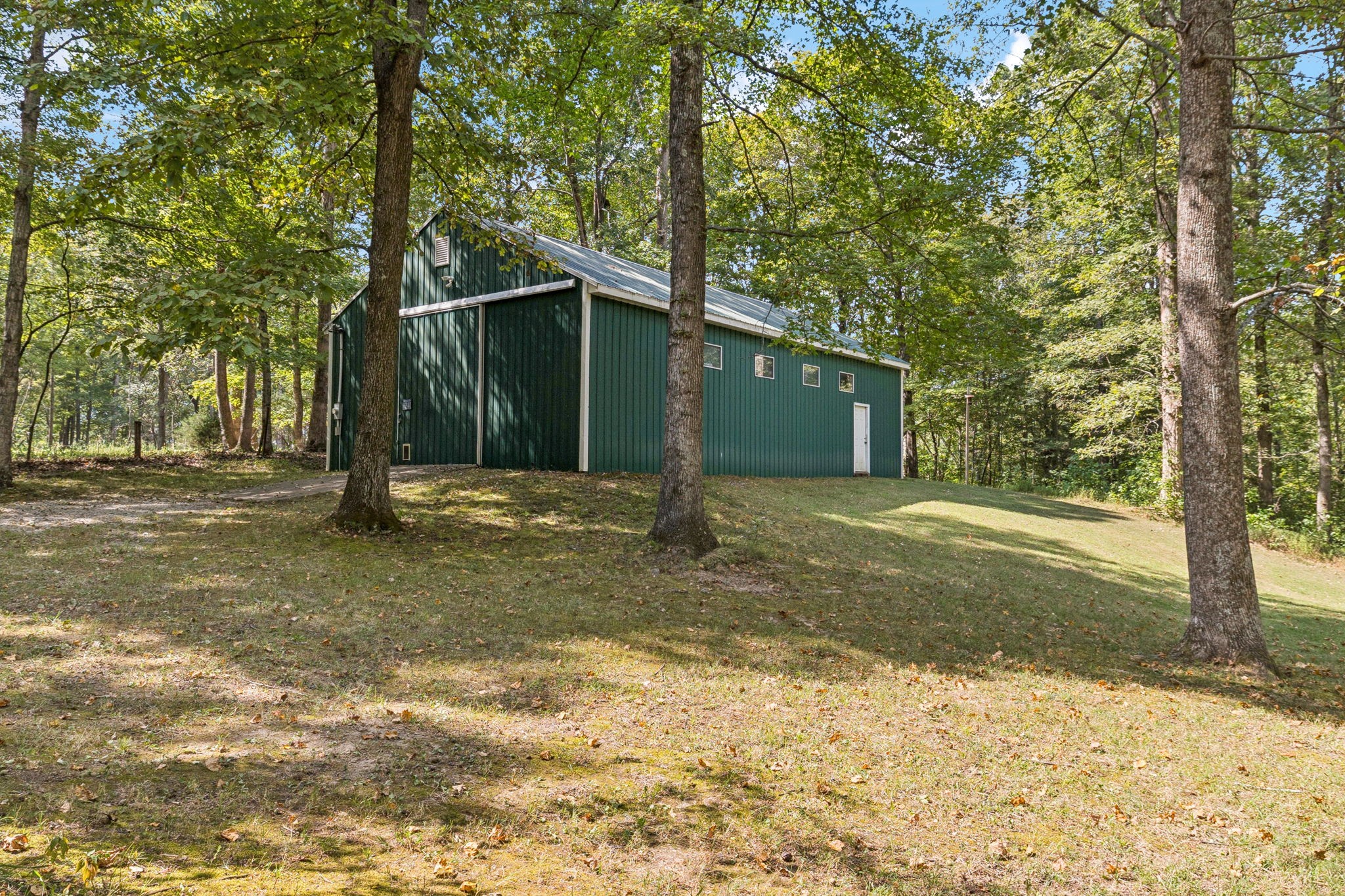 1060 Satterwhite Road Ashland City, TN 37015 - Photo 34 of 38 a view of a house with backyard and trees