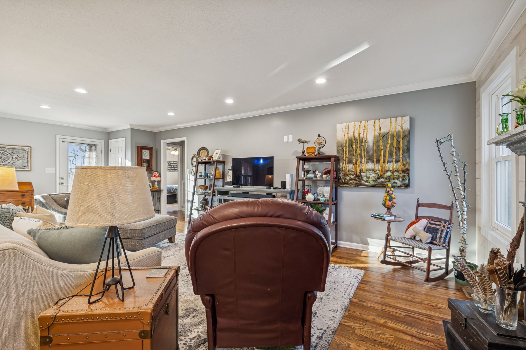 1060 Satterwhite Road Ashland City, TN 37015 - Photo 5 of 38 a living room with furniture a fireplace and a large window