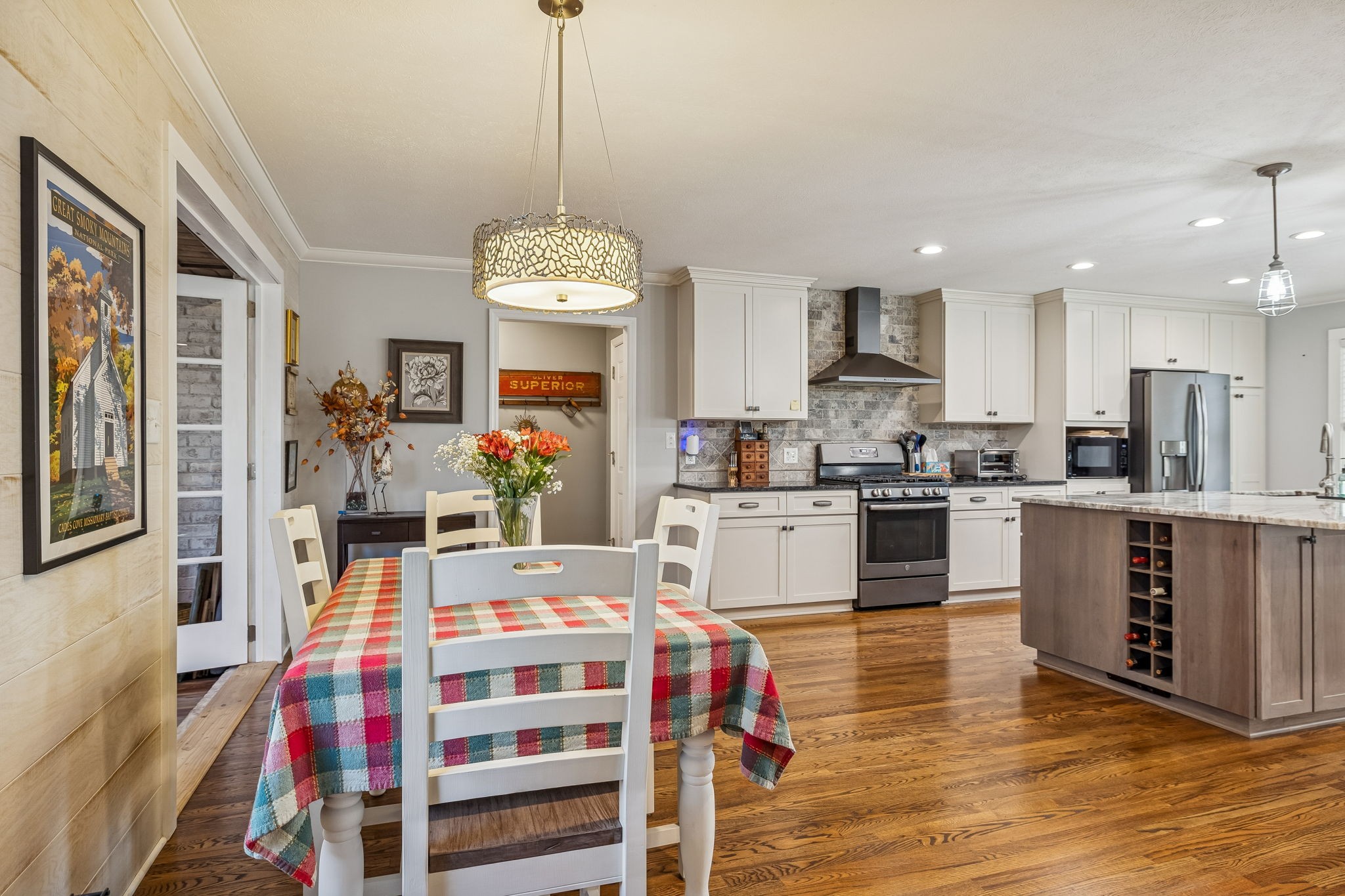 1060 Satterwhite Road Ashland City, TN 37015 - Photo 9 of 38 a large kitchen with kitchen island a island a stove a sink a dining table and chairs