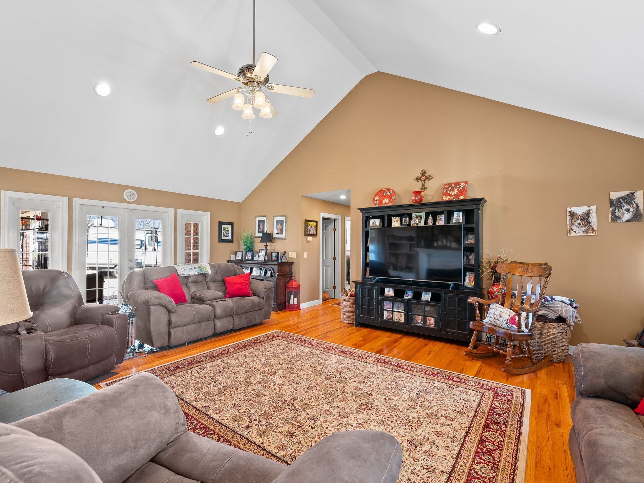 181 Hickory Grove Road Huntland, TN 37345 - Photo 12 of 41 a living room with furniture a flat screen tv and a floor to ceiling window