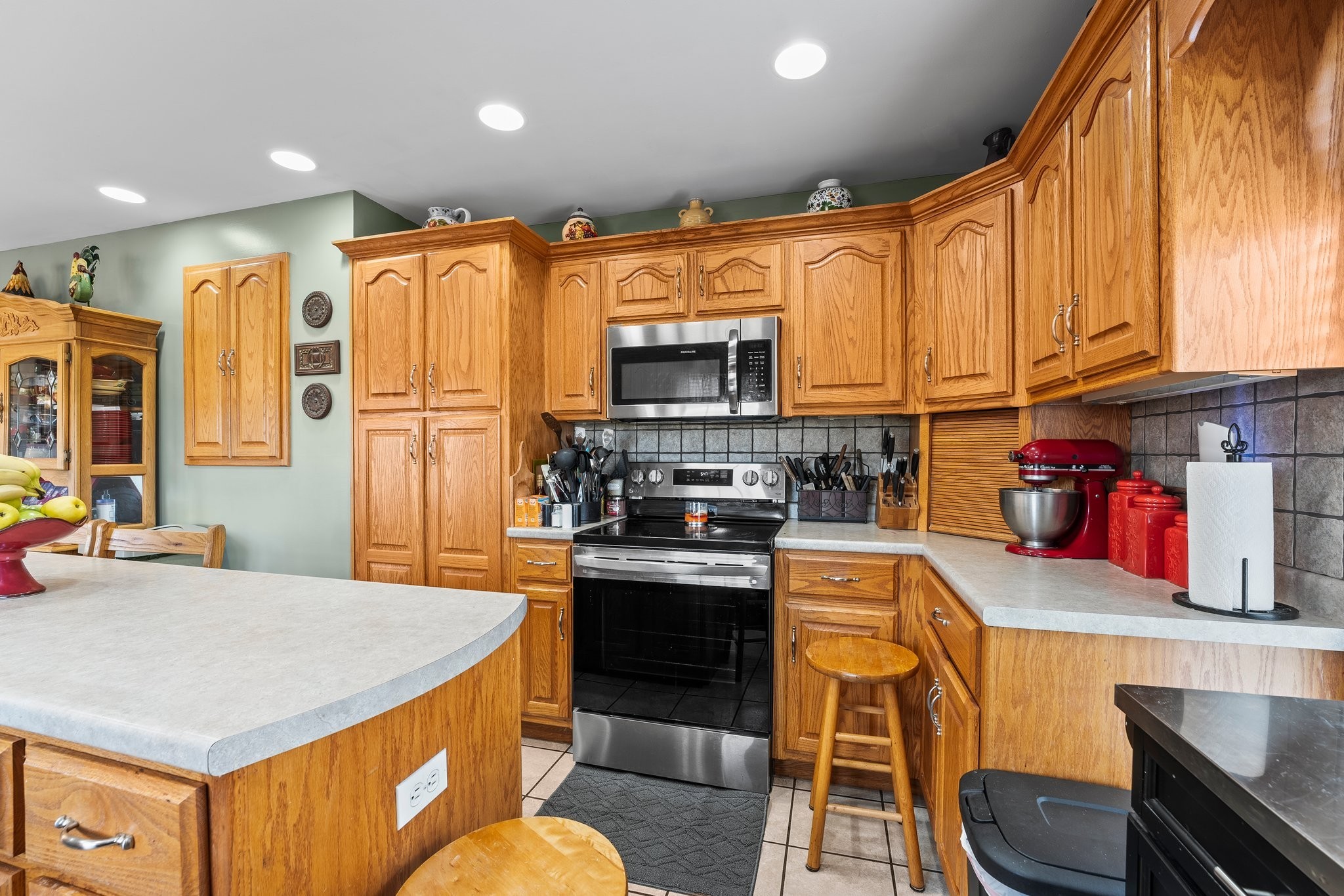 181 Hickory Grove Road Huntland, TN 37345 - Photo 17 of 41 a kitchen with stainless steel appliances granite countertop a stove a sink and a refrigerator
