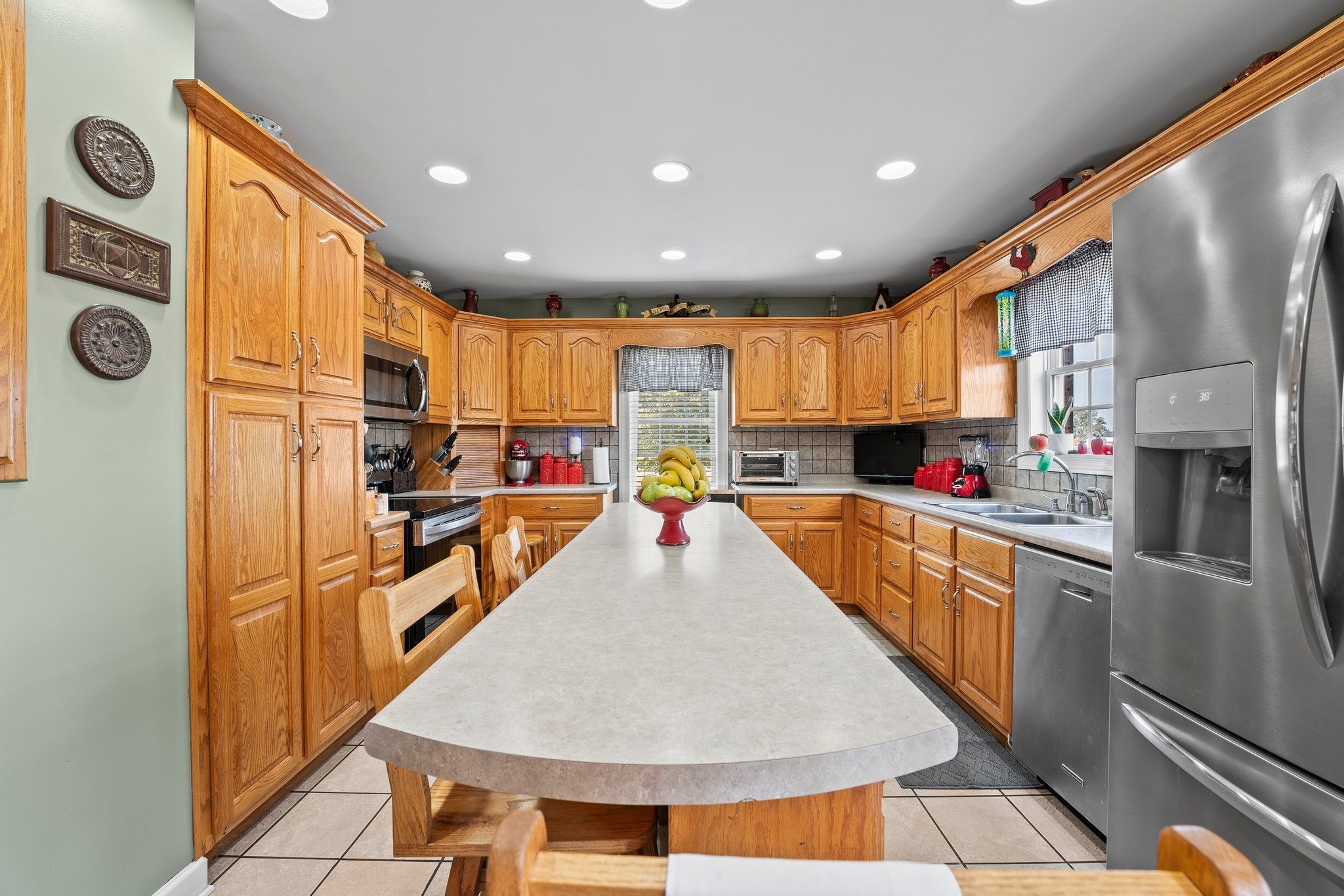 181 Hickory Grove Road Huntland, TN 37345 - Photo 18 of 41 a kitchen with stainless steel appliances granite countertop a refrigerator a stove top oven and cabinets