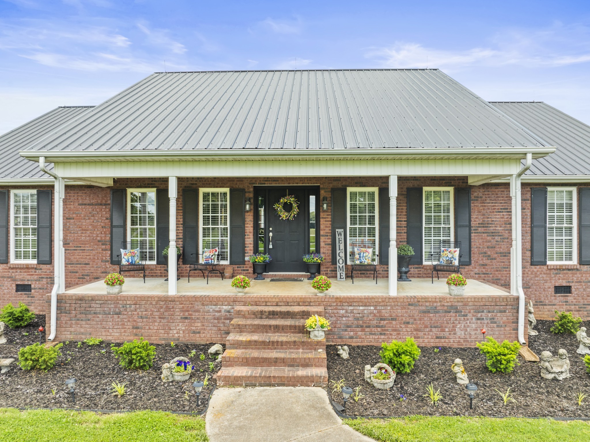 181 Hickory Grove Road Huntland, TN 37345 - Photo 3 of 41 a front view of a house with a porch