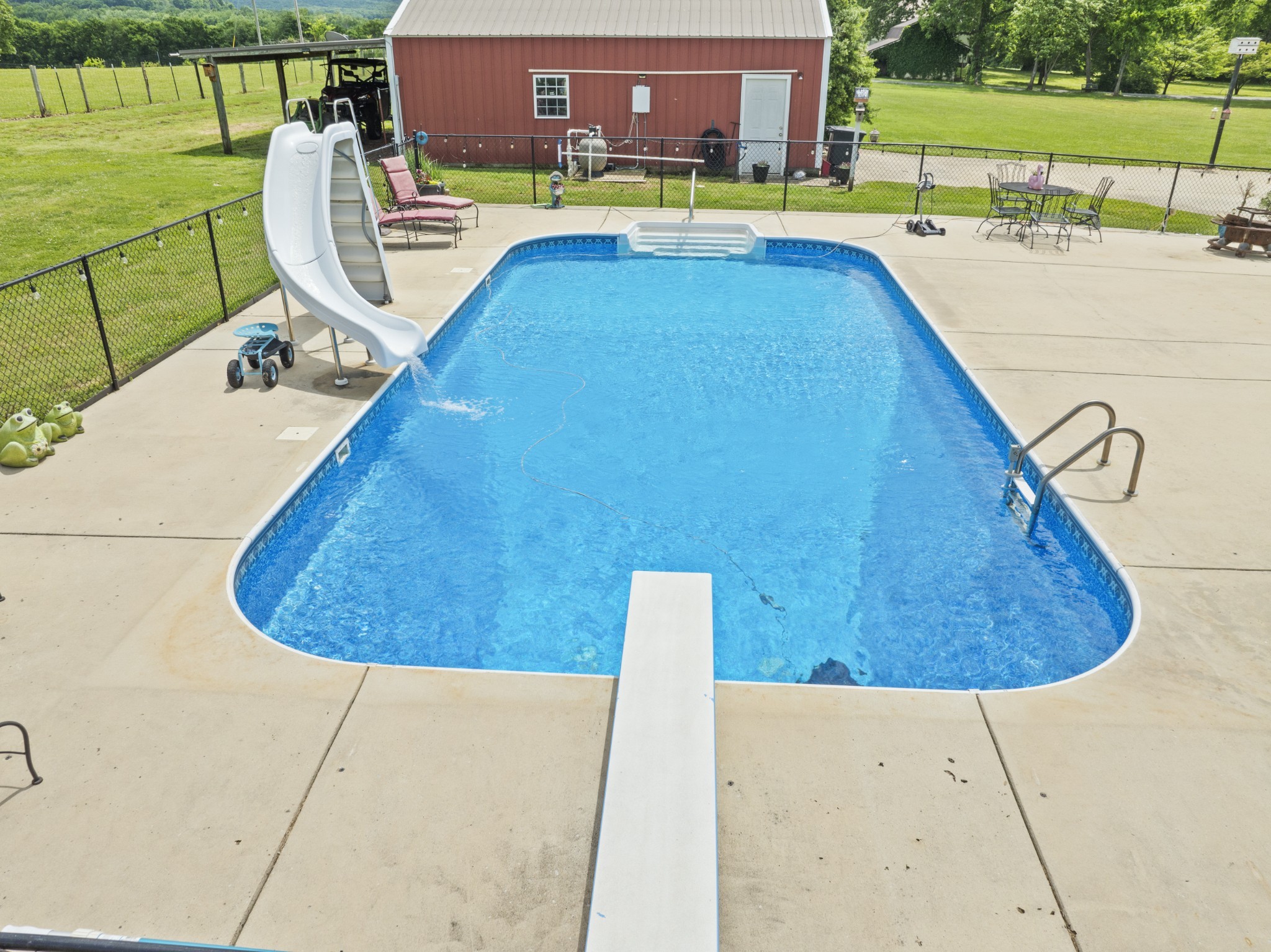 181 Hickory Grove Road Huntland, TN 37345 - Photo 7 of 41 a view of a swimming pool with a lounge chair