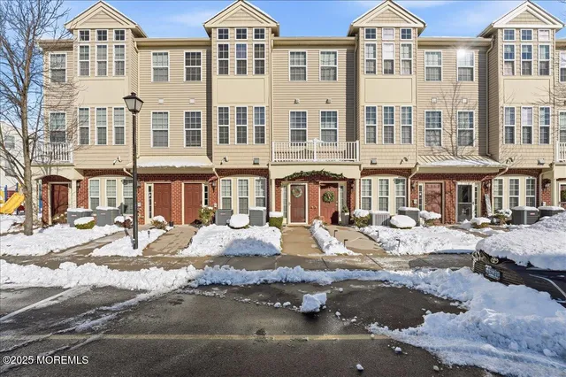 a view of a large building and a yard