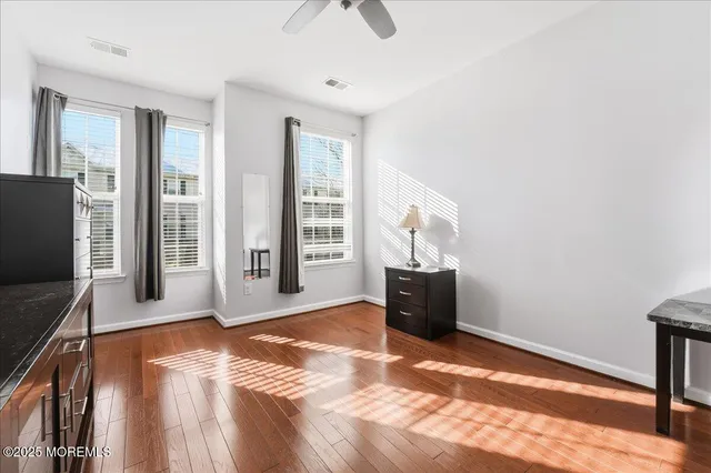 a view of livingroom with workspace and a window