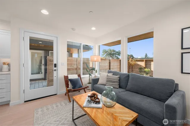 a living room with furniture and a window