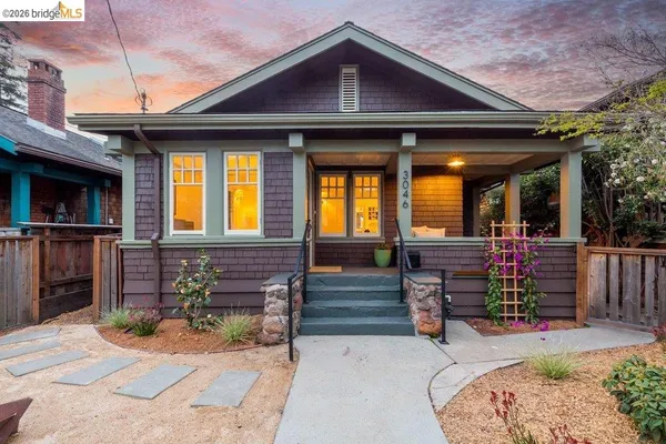 a view of backyard with outdoor seating a patio and plants