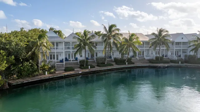 a view of residential houses with outdoor space and lake view