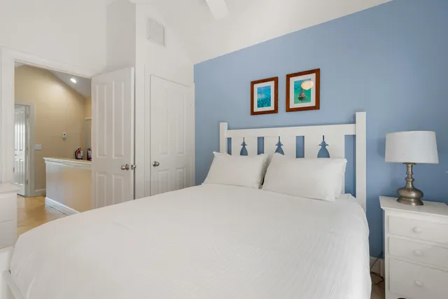 a bed room with a bed and a night stand